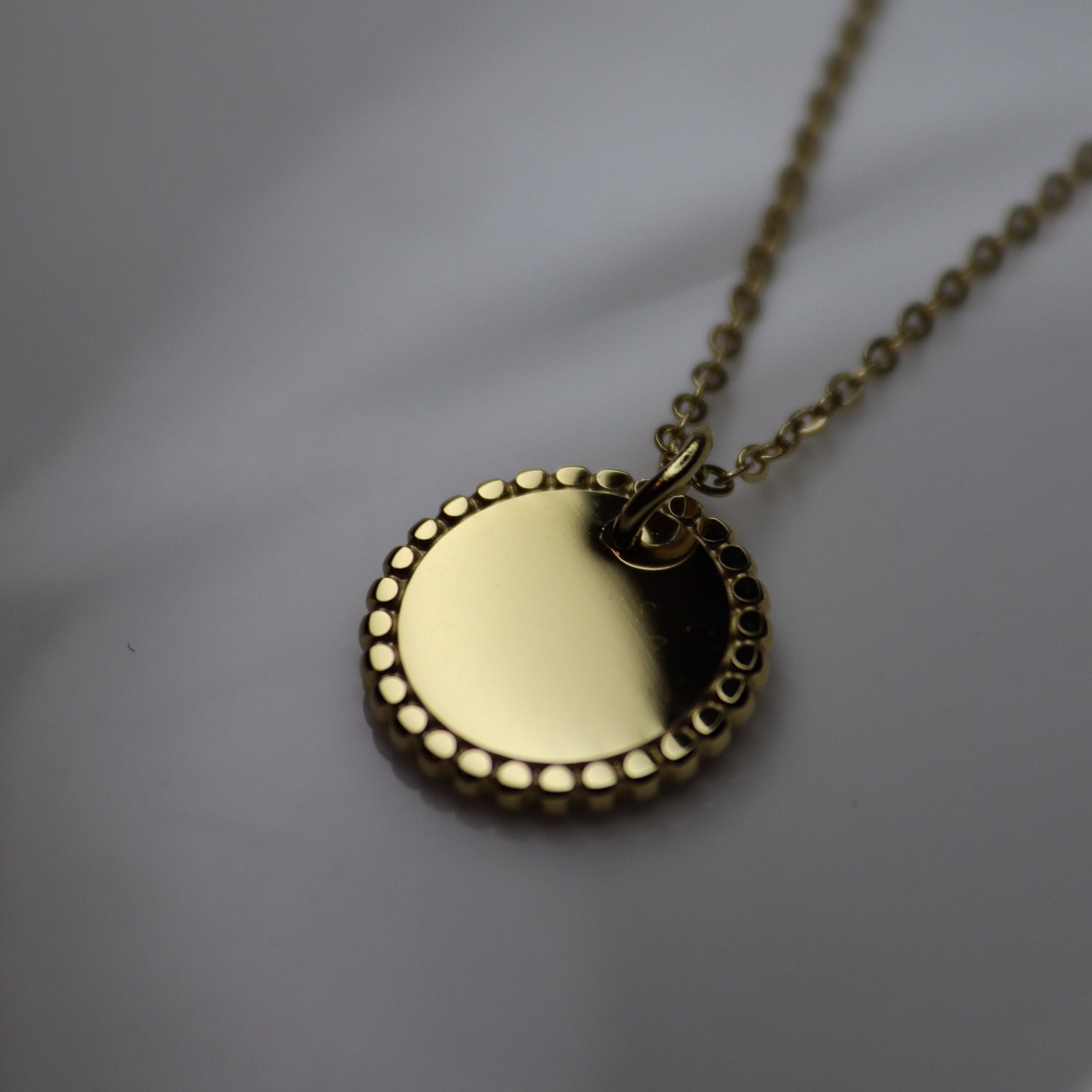 Engraved round charm necklace